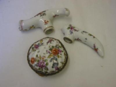 Appraisal: TWO PORCELAIN CANE HANDLES painted with flowers on a white