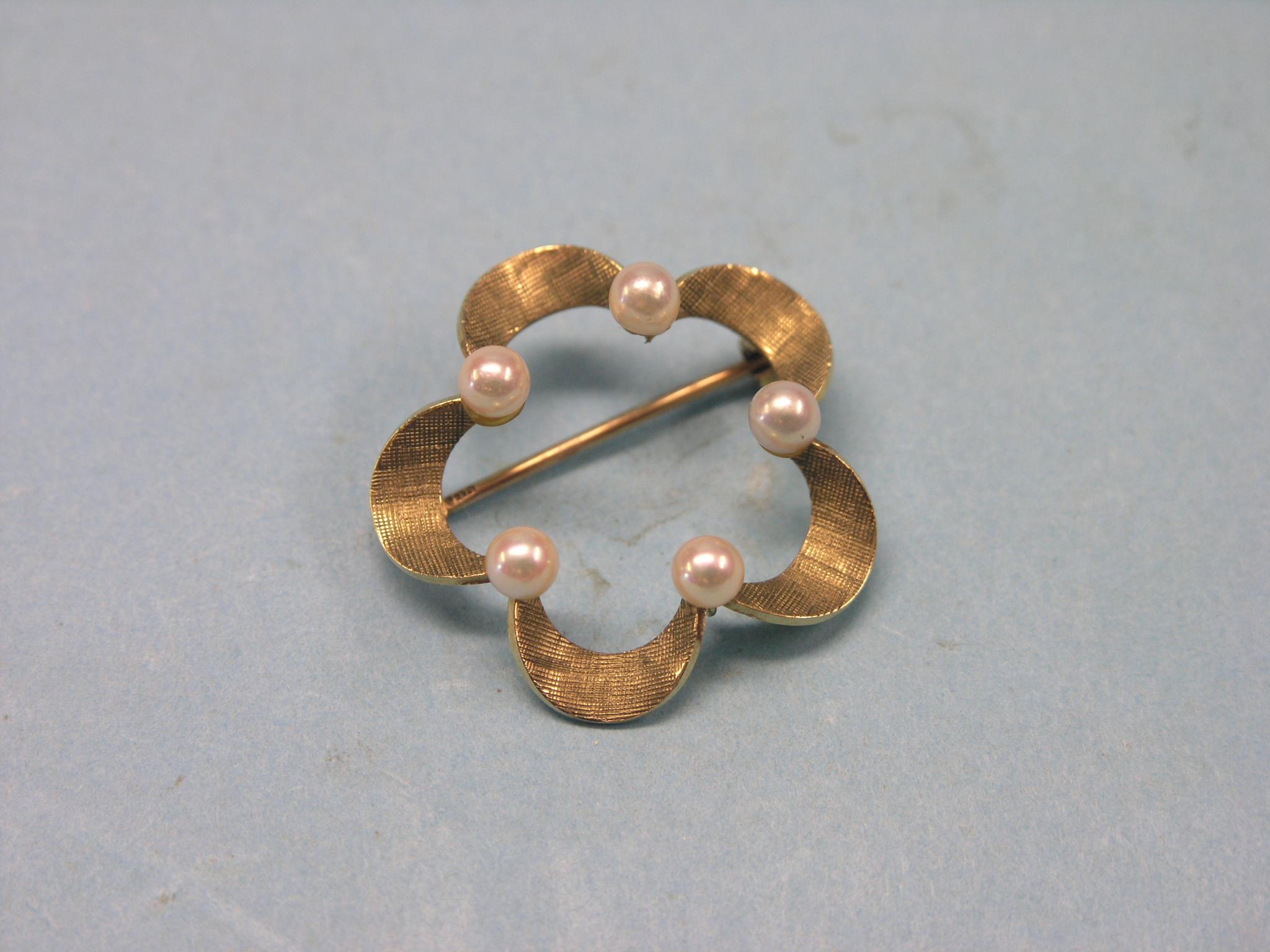 Appraisal: A ct gold brooch flower-shape set five small pearl-type stones