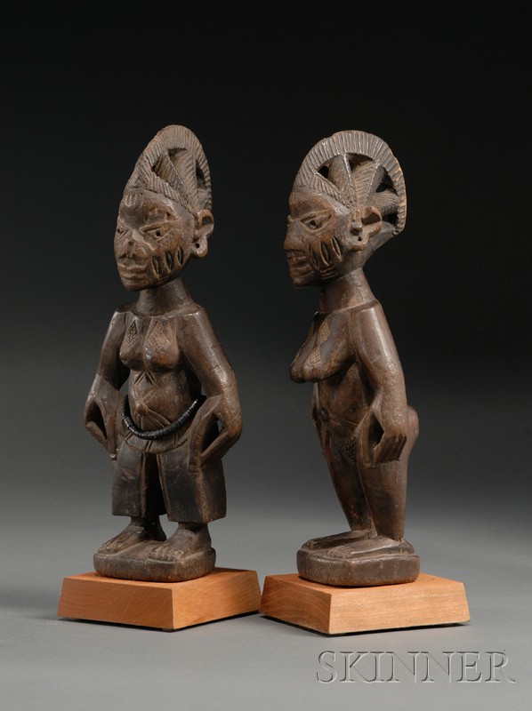 Appraisal: Two African Carved Wood Ibeji Dolls Yoruba matched male and