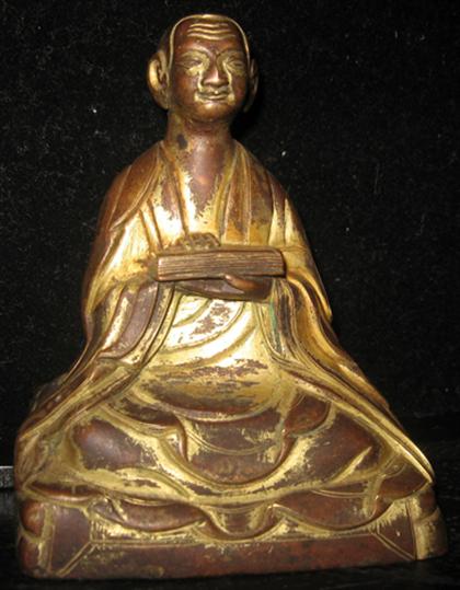 Appraisal: Sino-Tibetan gilt bronze figure of Arhat Gopaka th century Seated