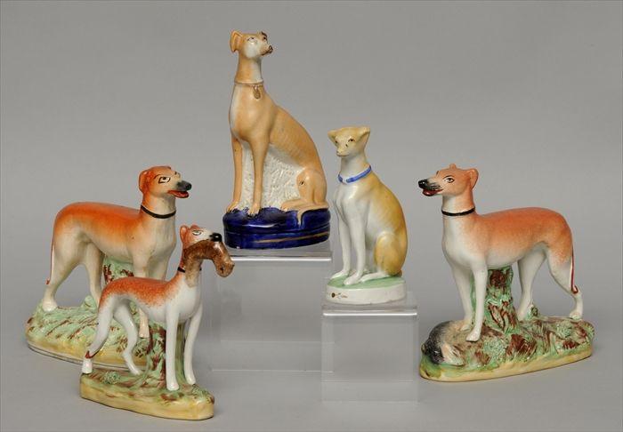 Appraisal: FIVE STAFFORDSHIRE FIGURES OF WHIPPETS Including a pair with naturalistically