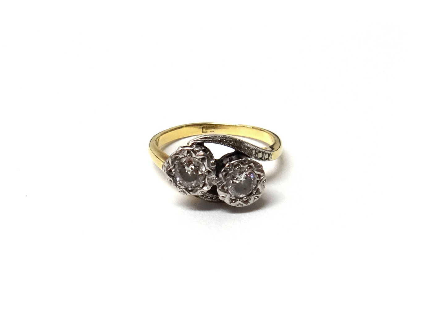 Appraisal: A gold and diamond set two stone ring mounted with