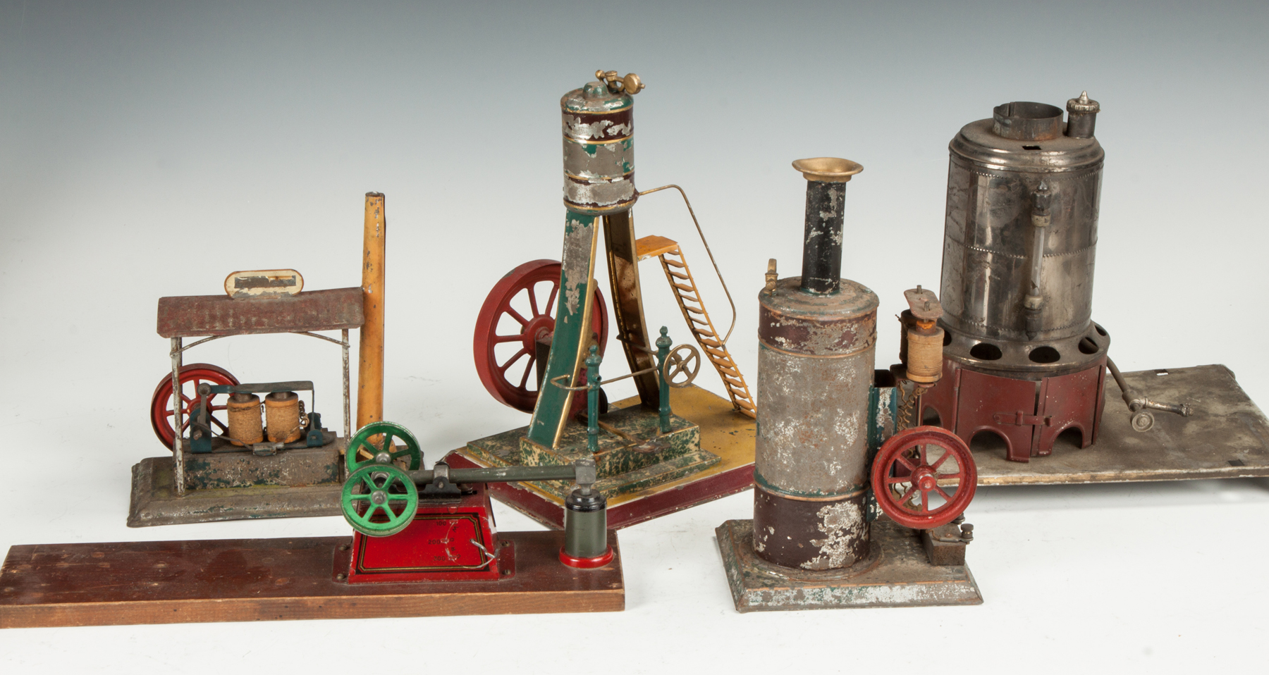 Appraisal: Group of Various German Painted Tin Steam Engines Accessories th