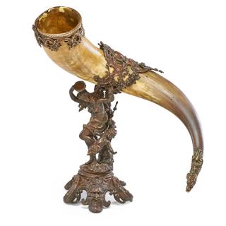 Appraisal: BRONZE MOUNTED DRINKING HORN Scroll and figural decorated base with