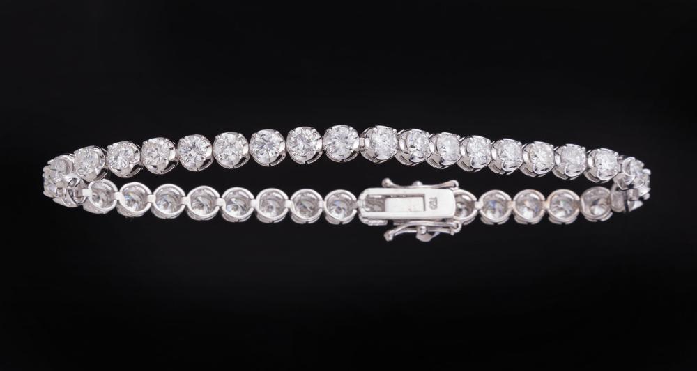 Appraisal: kt White Gold and Diamond Bracelet comprised of half bezel