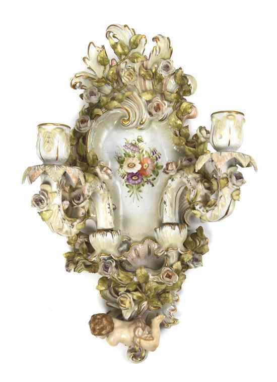 Appraisal: A Continental Porcelain Two-Light Sconce having molded floral decoration and