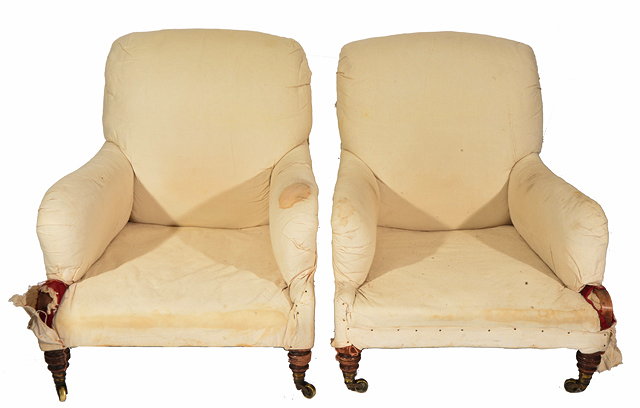 Appraisal: A NEAR PAIR OF VICTORIAN HOWARD AND SONS ARMCHAIRS standing