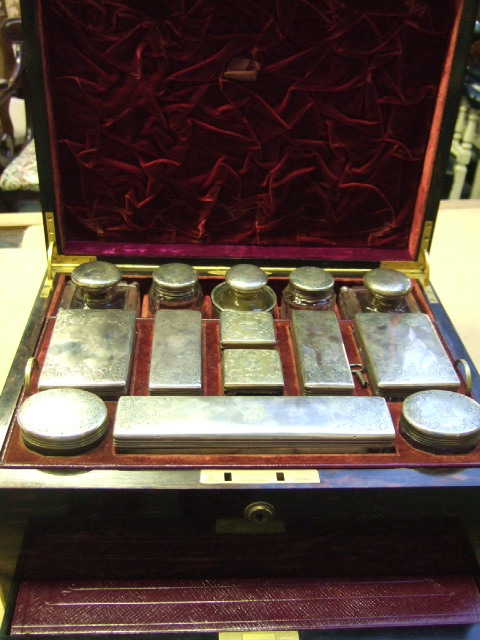 Appraisal: A Victorian silver mounted gentleman's travelling dressing set mark of