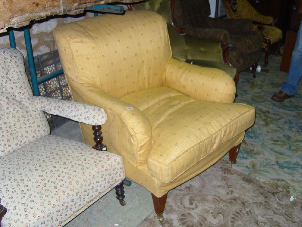 Appraisal: An Edwardian easy chair with shaped arms recently upholstered finish