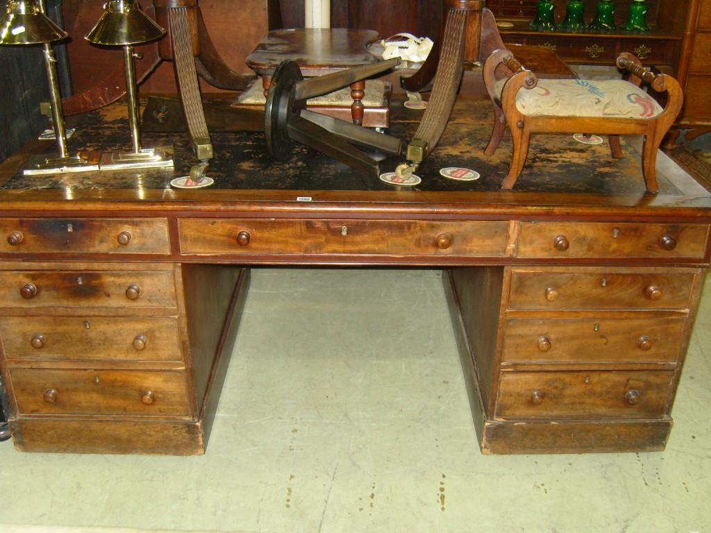 Appraisal: A Victorian mahogany kneehole partners desk fitted with an arrangement