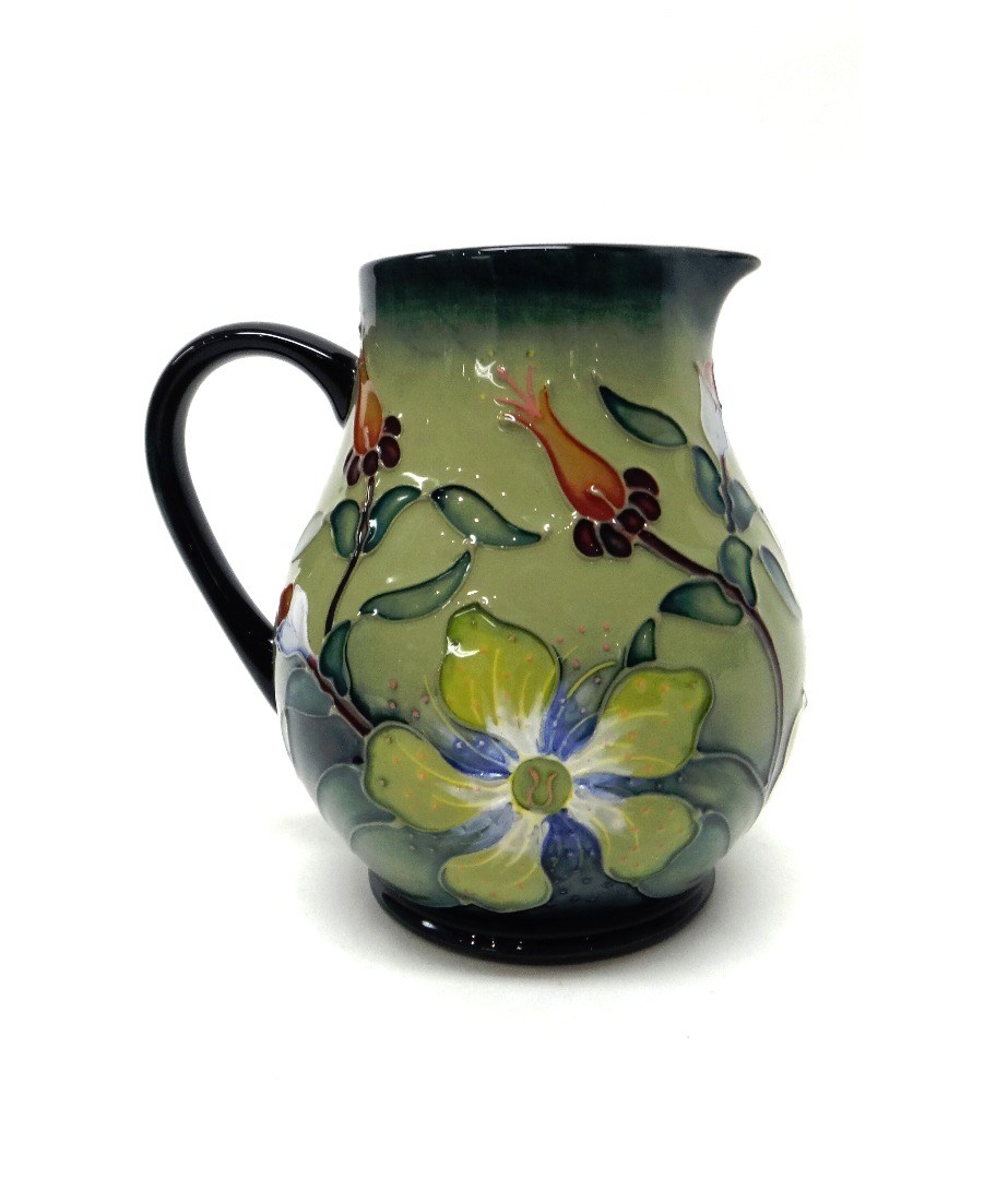 Appraisal: A Moorcroft 'Flower' jug circa two tone blue green ground