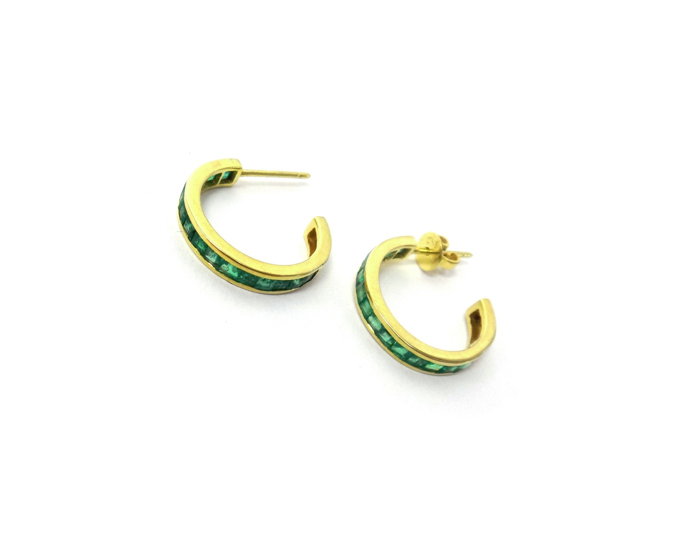 Appraisal: A pair of gold and emerald set earrings each in