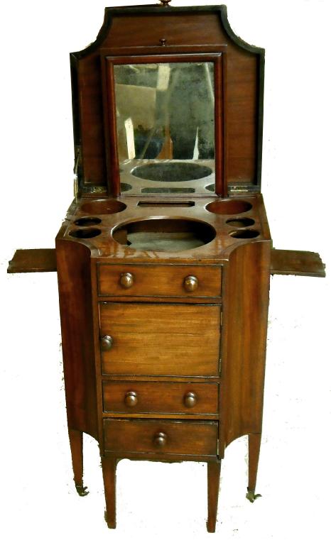 Appraisal: George III mahogany gentleman's wash stand with concave sides and