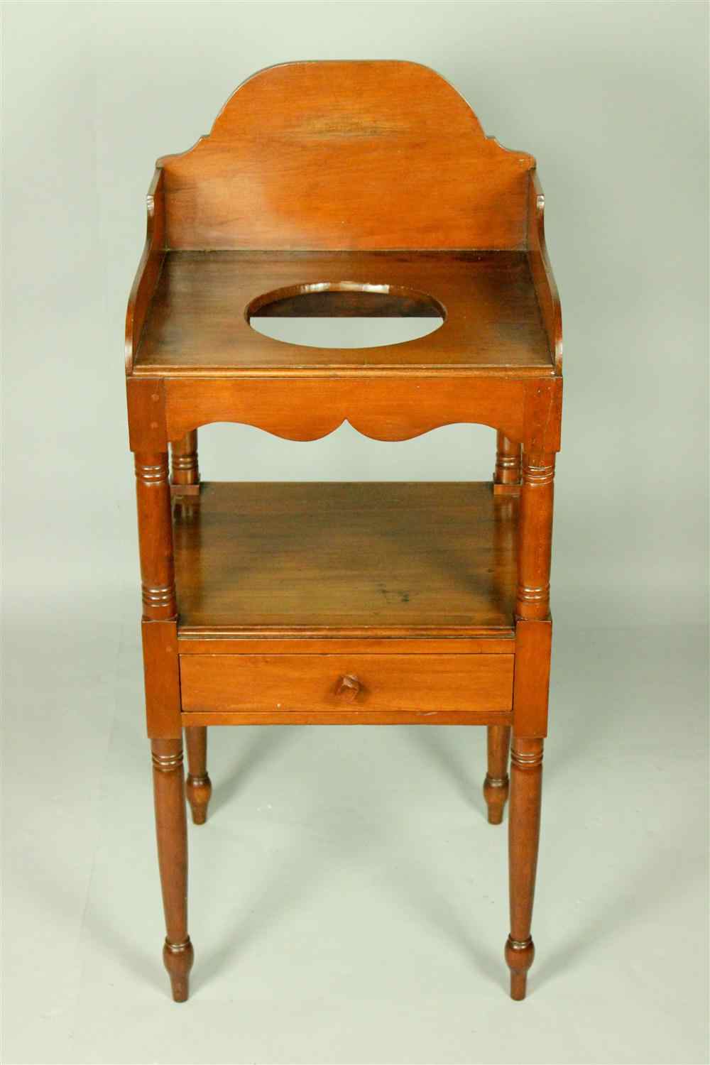 Appraisal: LATE SHERATON CHERRYWOOD WASHSTAND having a three-sided raised wooded gallery