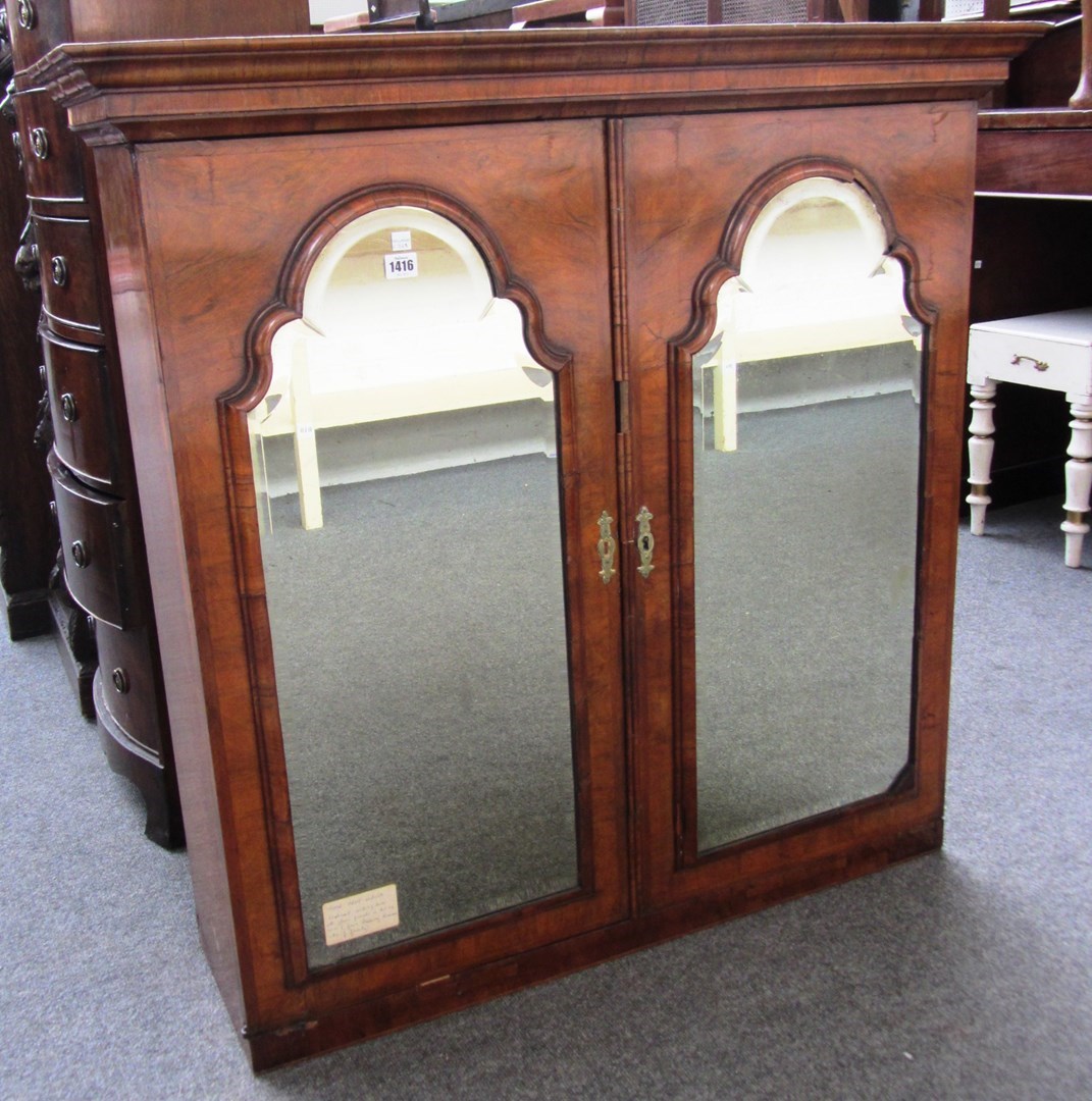 Appraisal: An early th century figured walnut bureau bookcase top with