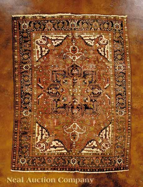 Appraisal: A Persian Heriz Carpet red and cream ground central medallion