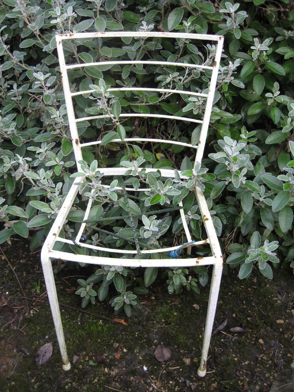 Appraisal: Four white metal rail back Garden Chairs