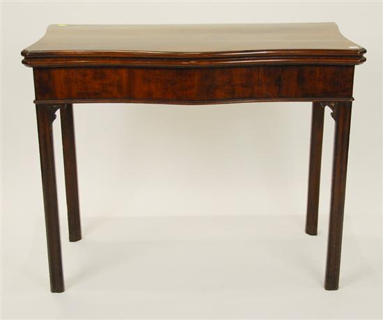 Appraisal: GEORGE III MAHOGANY SERPENTINE FRONT LIFT TOP GAMES TABLE with