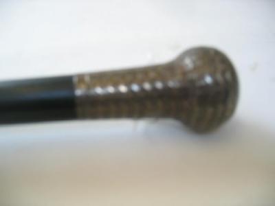 Appraisal: AN EBONY WALKING STICK with engine turned silver ball grip