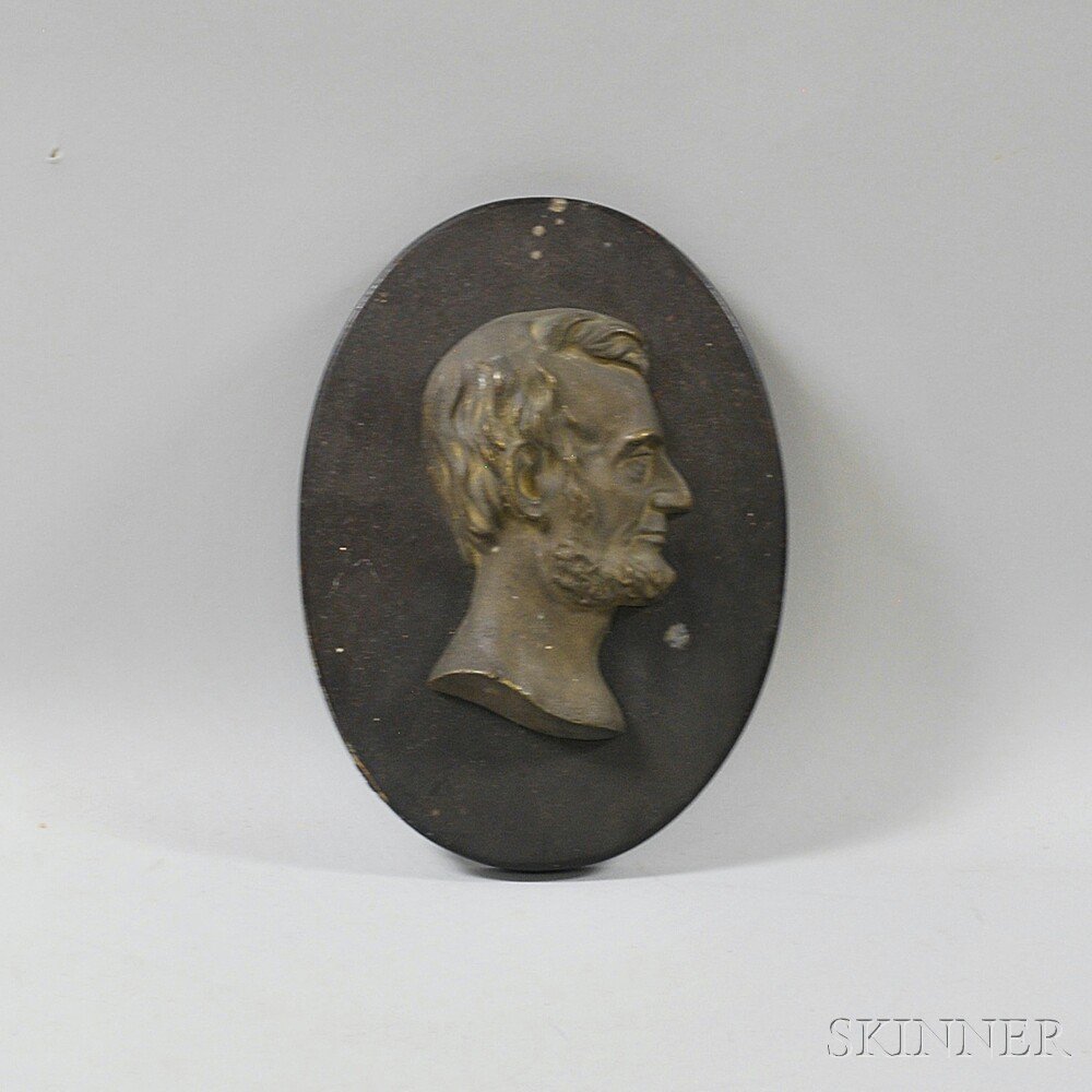 Appraisal: Lincoln Bust Plaque the bronze profile bust mounted to an