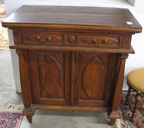 Appraisal: COUNTRY TEAKWOOD SIDE CABINET having a flat rectangular top and