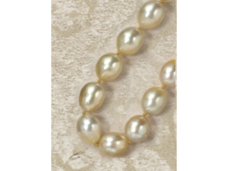 Appraisal: GOLD BAROQUE PEARLS South sea pearl necklace made of elongated