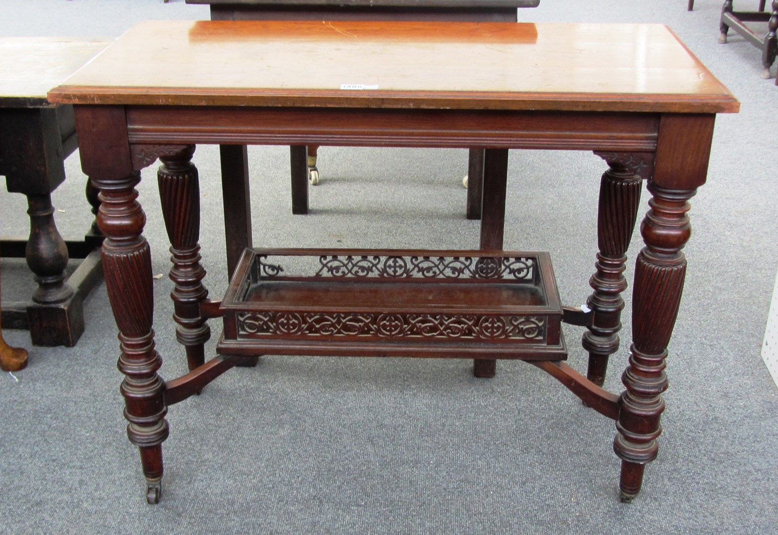 Appraisal: A th century mahogany rectangular side table on spiral fluted