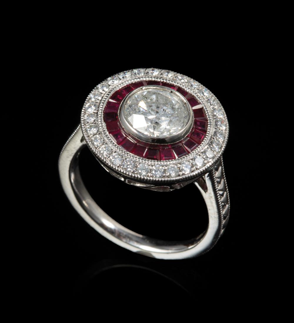 Appraisal: Platinum Diamond and Ruby Ring center bezel set round brilliant