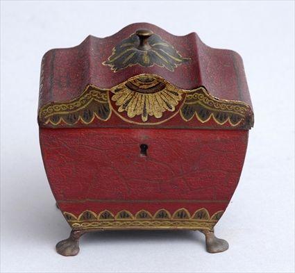 Appraisal: MAROON GROUND TOLE PEINTE TEA CADDY The boat-form bowl with