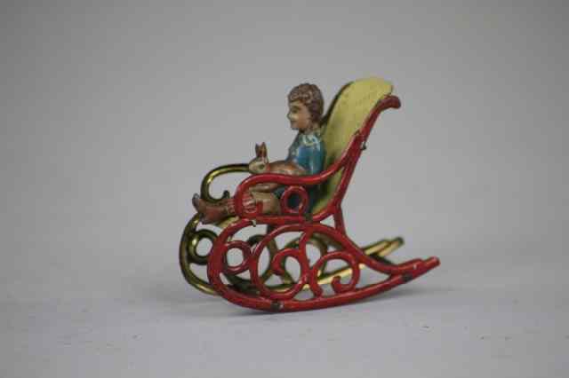 Appraisal: ROCKING CHAIR PENNY TOY Meier pre-war Germany tin red rocking