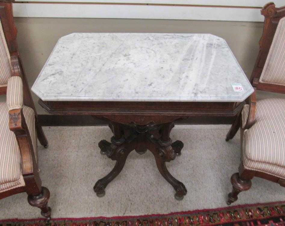 Appraisal: VICTORIAN MARBLE-TOP WALNUT LAMP TABLE American late th century rectangular