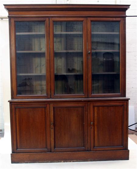 Appraisal: A Victorian mahogany bookcase and undercabinet the moulded projected cornice