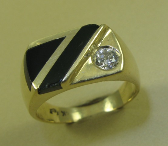 Appraisal: MAN'S DIAMOND BLACK ONYX AND FOURTEEN KARAT GOLD RING inset