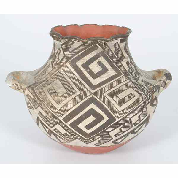 Appraisal: Acoma Handled Jar decorated with hatched geometrics reminiscent of an