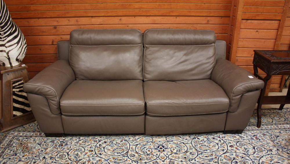 Appraisal: A CONTEMPORARY LEATHER DOUBLE POWER RECLINER SOFA dated overall mocha