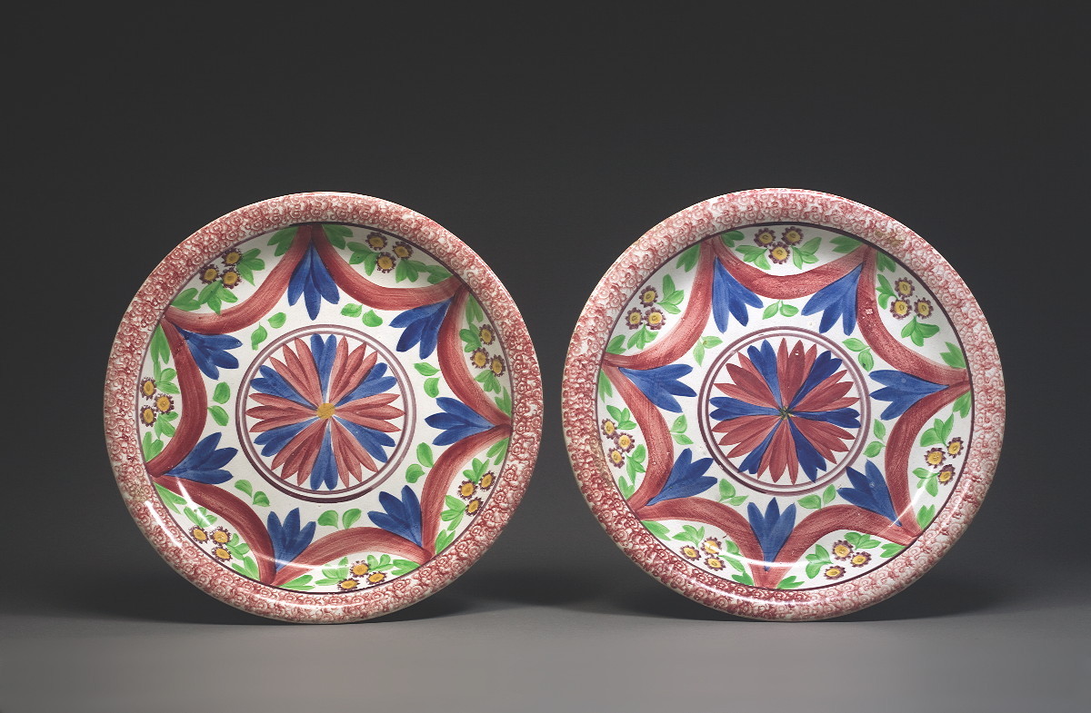 Appraisal: PAIR OF STAFFORDSHIRE EARTHENWARE ENAMEL AND SPONGE-DECORATED CHARGERS MANN CO