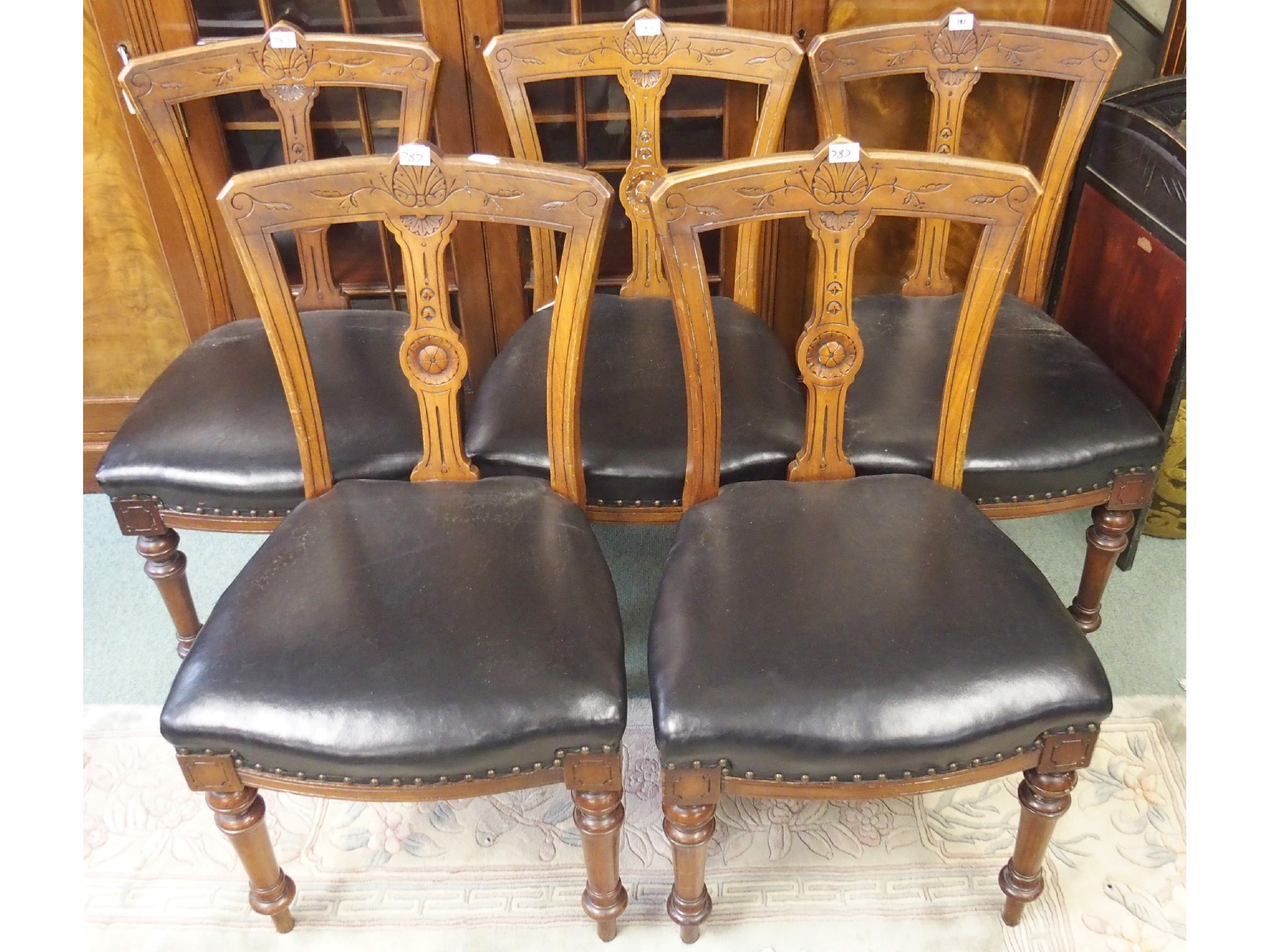 Appraisal: Five Victorian mahogany dining chairs with black leather seats