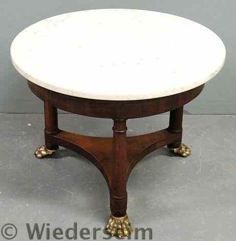 Appraisal: French style round marble top table with a mahogany base