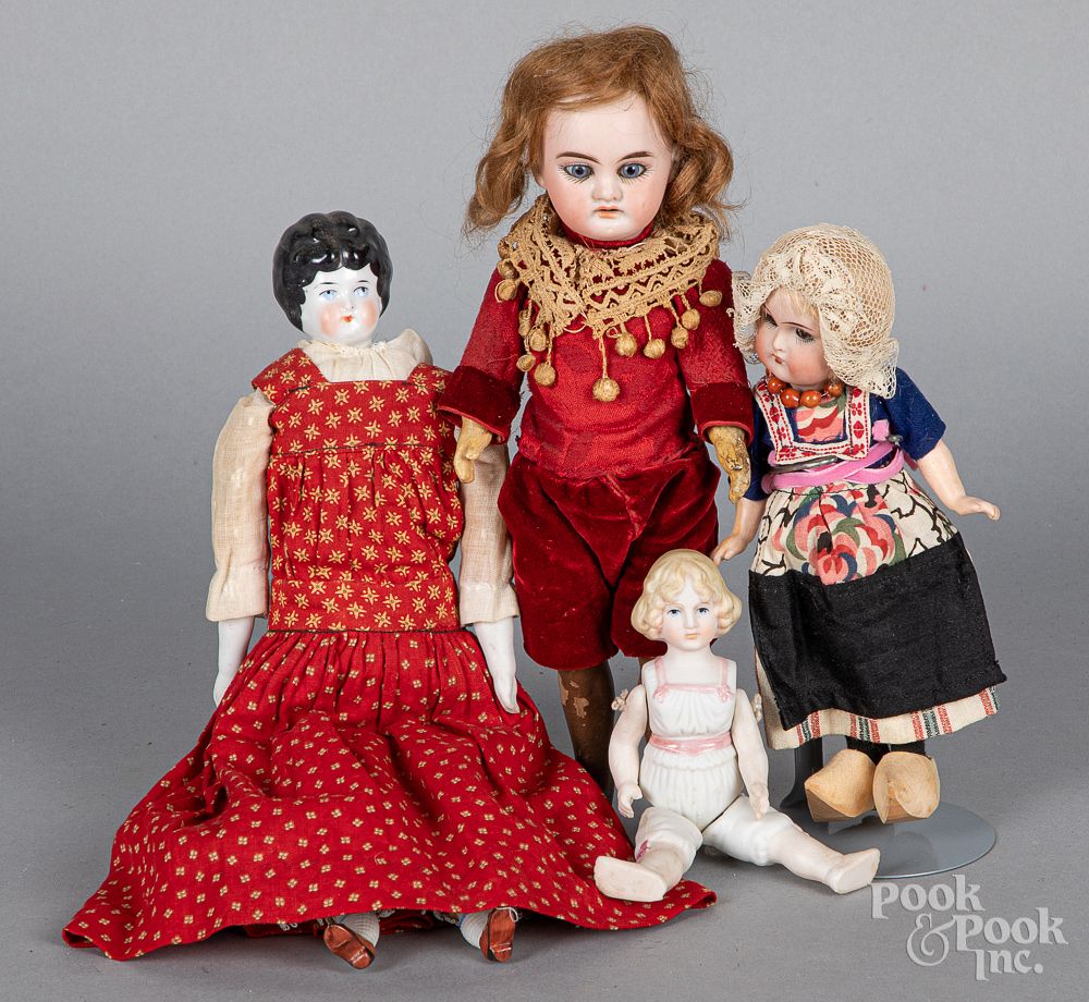 Appraisal: Four small bisque head dolls Four small bisque head dolls