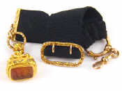 Appraisal: An antique carat gold mounted black ribbon fob with a