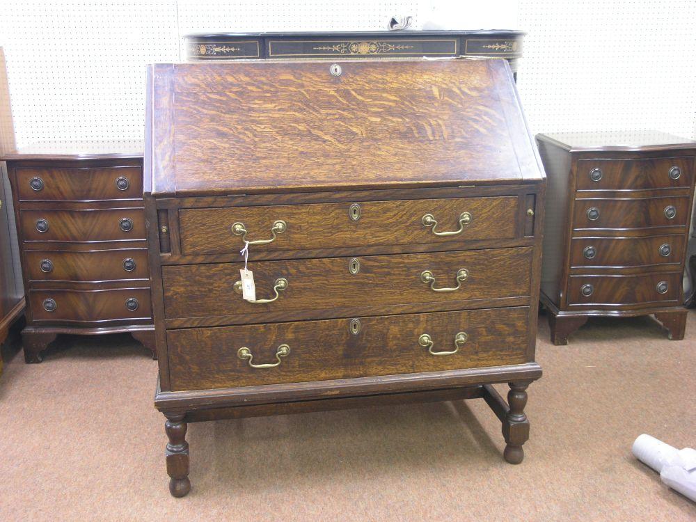 Appraisal: An early th century solid dark oak bureau fall front