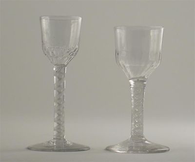 Appraisal: Two wine glasses with moulded bowls and opaque twist stems