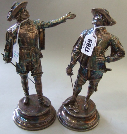 Appraisal: Emille Guillemin a pair of silvered bronze figures of cavaliers