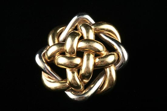 Appraisal: K YELLOW AND WHITE GOLD KNOT-FORM BROOCH Loosely woven configuration