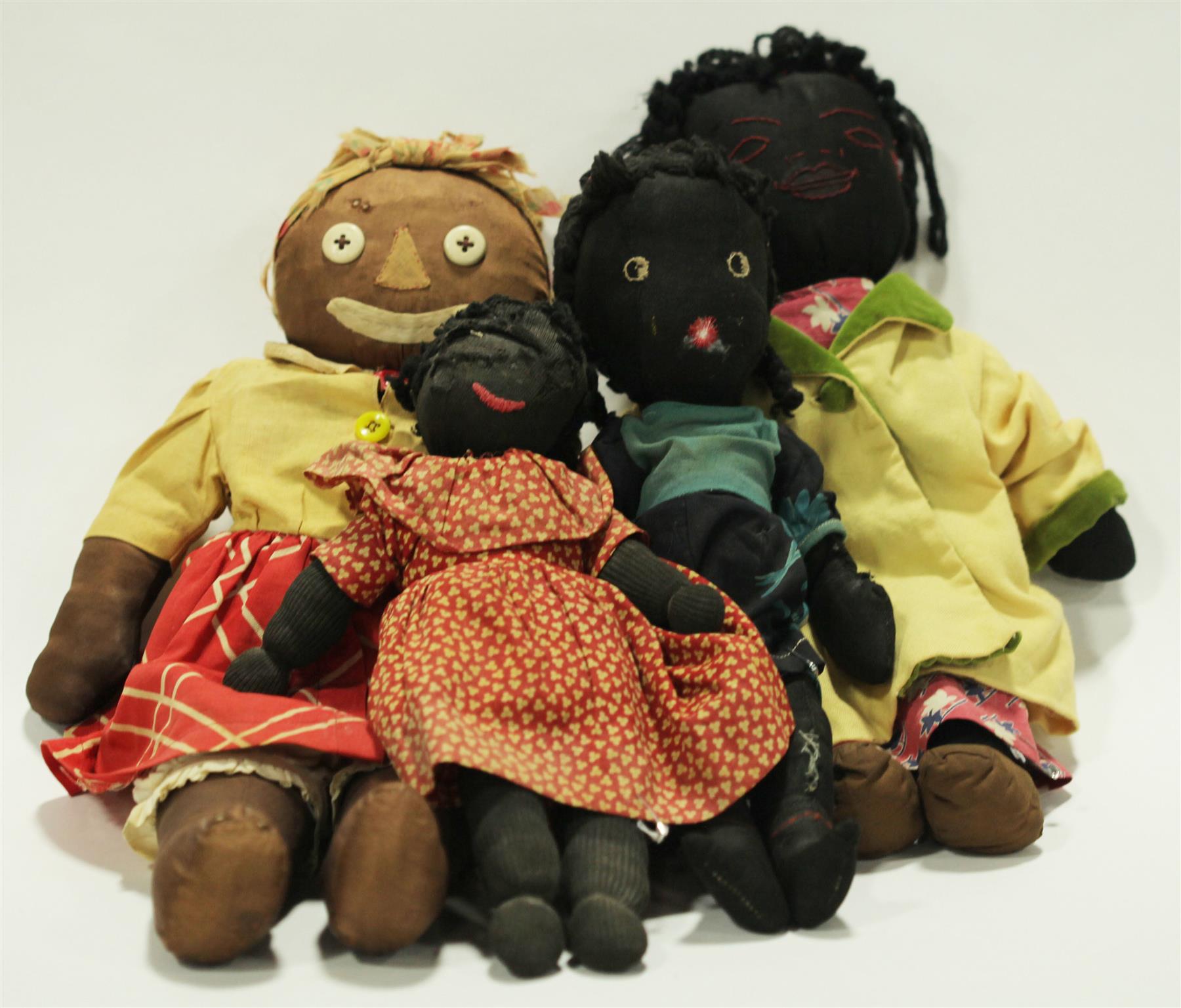 Appraisal: FOUR BLACK CLOTH DOLLS American early th century The large