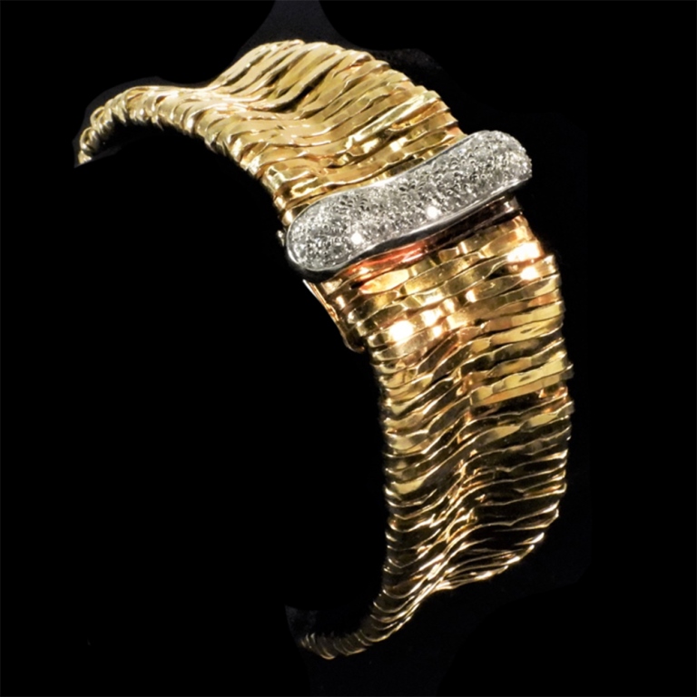 Appraisal: ORLANDINI K GOLD DIAMOND BRACELET K yellow gold mesh ribbed