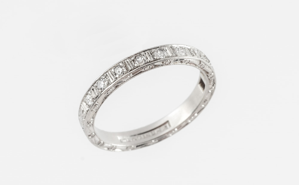 Appraisal: PLATINUM DIAMOND ETERNITY BAND RING Hand engraved band with Swiss