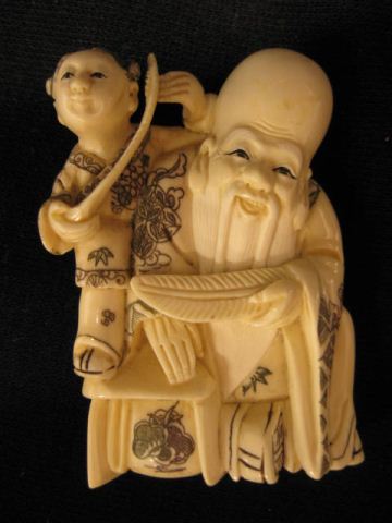 Appraisal: Carved Ivory Netsuke of Fukurokuju god of wisdom longevity holding