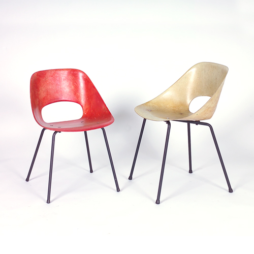 Appraisal: STEINER Two molded fiberglass side chairs one red and the