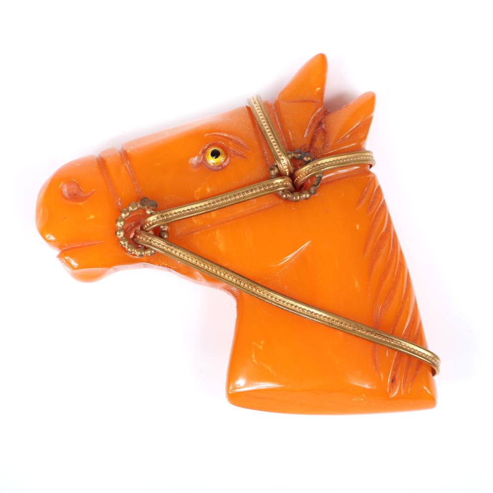 Appraisal: VINTAGE BAKELITE EQUESTRIAN FIGURAL HORSE HEAD BROOCH IN CARVED BUTTERSCOTCH